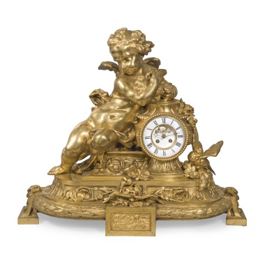 Каминные часы с фигурой Амура